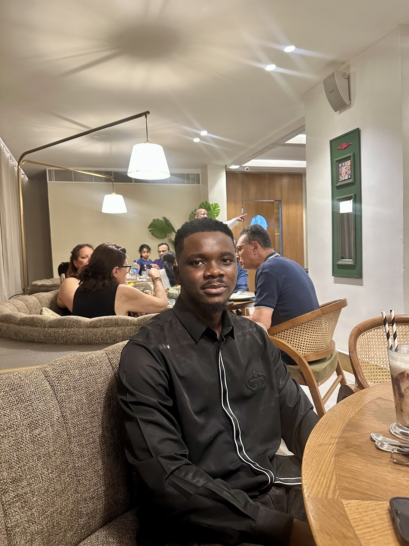 Daniel Larayetan meeting clients in a lounge
